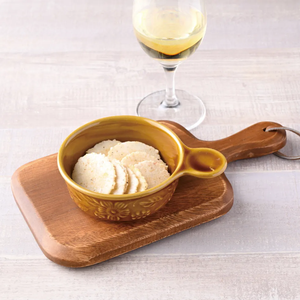 VivaEvi(ヴィヴァエビ)の商品画像。ラクレ・メルチーノは、白ワインとの相性が良いえびが主原料のおせんべい。